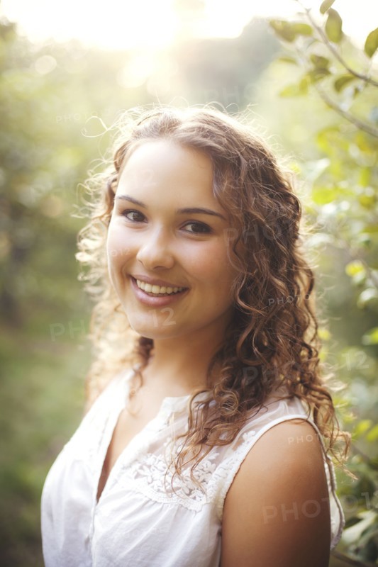 Smiling woman standing outdoors