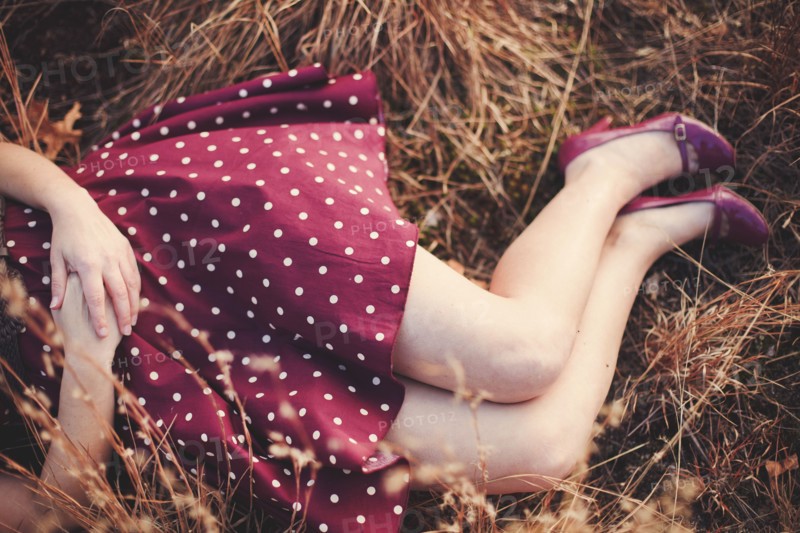 High angle view of woman laying in hay