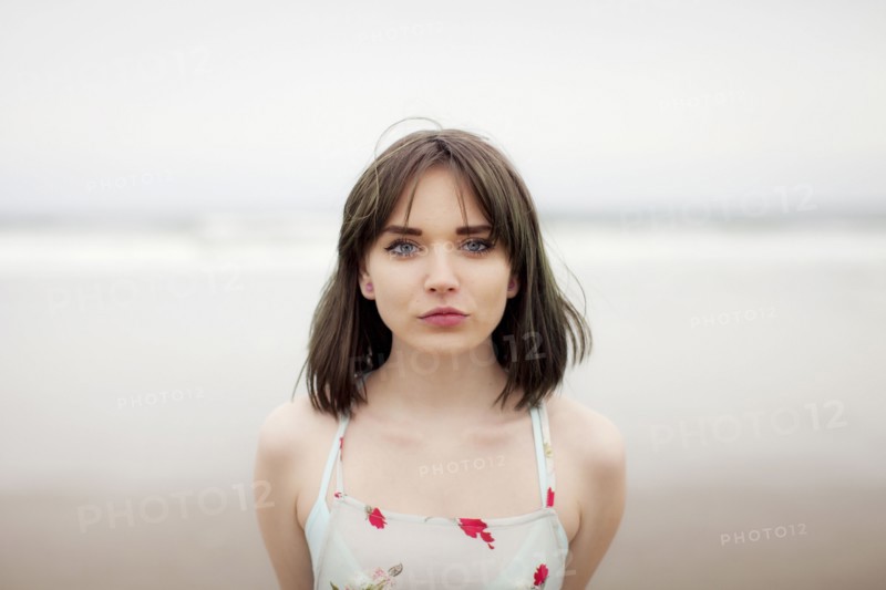 Caucasian woman standing on beach