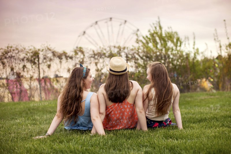 Caucasian women sitting in urban park