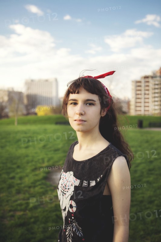 Caucasian woman standing in urban park