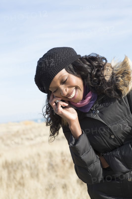 Close up of woman talking on cell phone outdoors