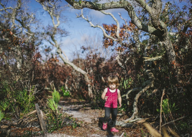 Mixed race girl walking on dirt path