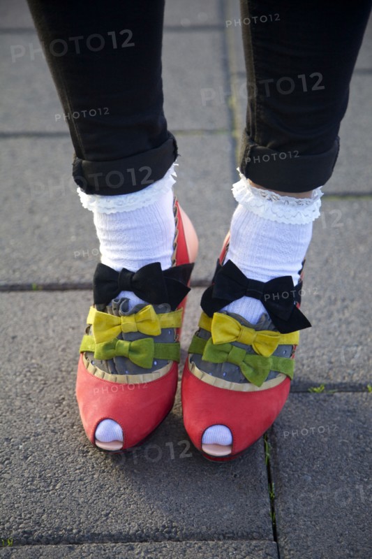 Close up of girl wearing bows on shoes