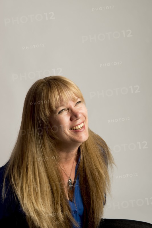 Smiling Caucasian woman looking up