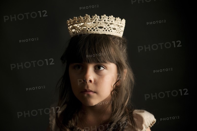 Girl wearing crown and princess costume