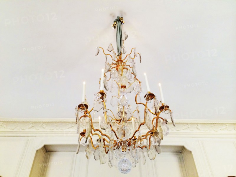 Low angle view of chandelier hanging from ceiling