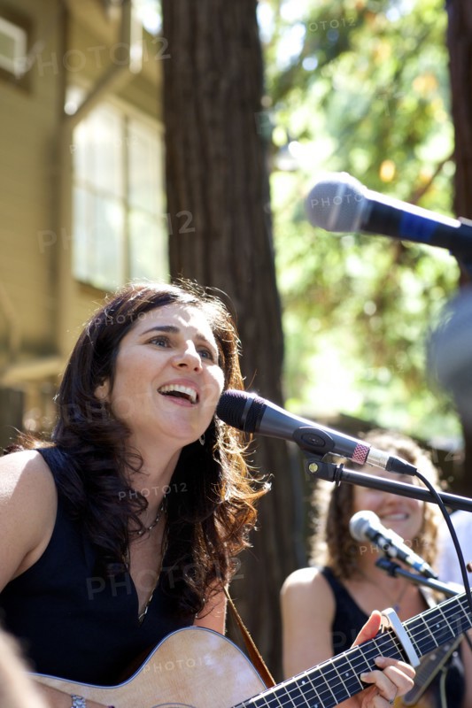 Musicians performing on stage outdoors