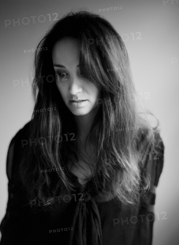 Close up of serious woman with long hair
