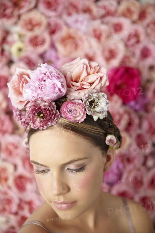 Smiling woman wearing flowers in her hair