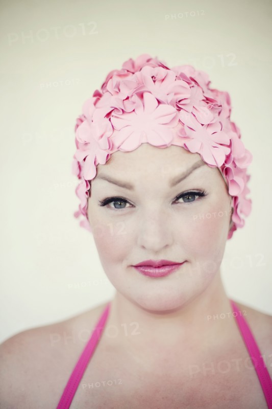 Woman wearing swim cap and bathing suit