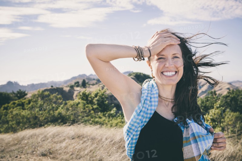Caucasian woman laughing in rural field