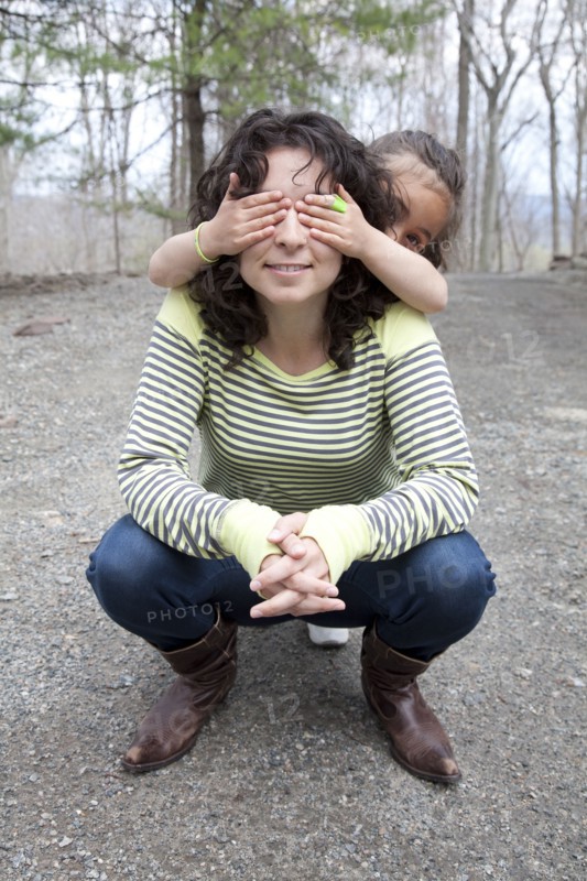 Caucasian mother and daughter playing in backyard