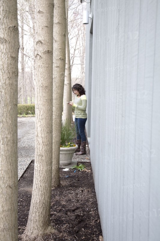 Caucasian woman using cell phone outdoors