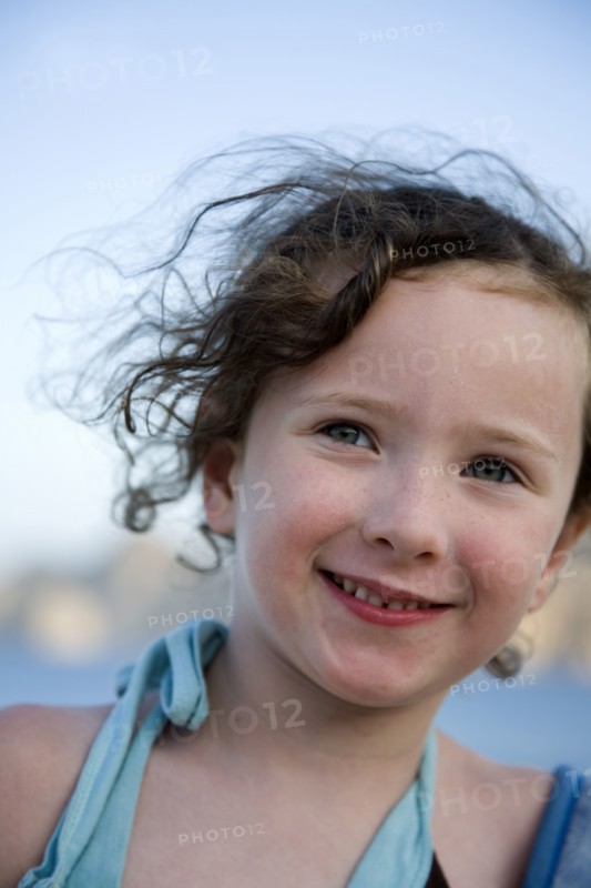 Close up of Caucasian girl smiling outdoors