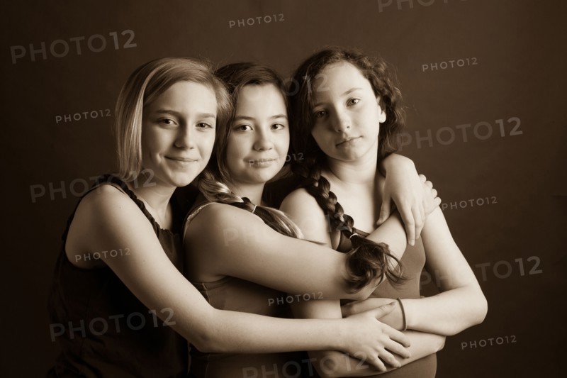 Smiling sisters hugging