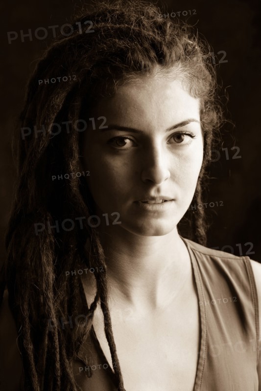 Close up of serious woman with dreadlocks