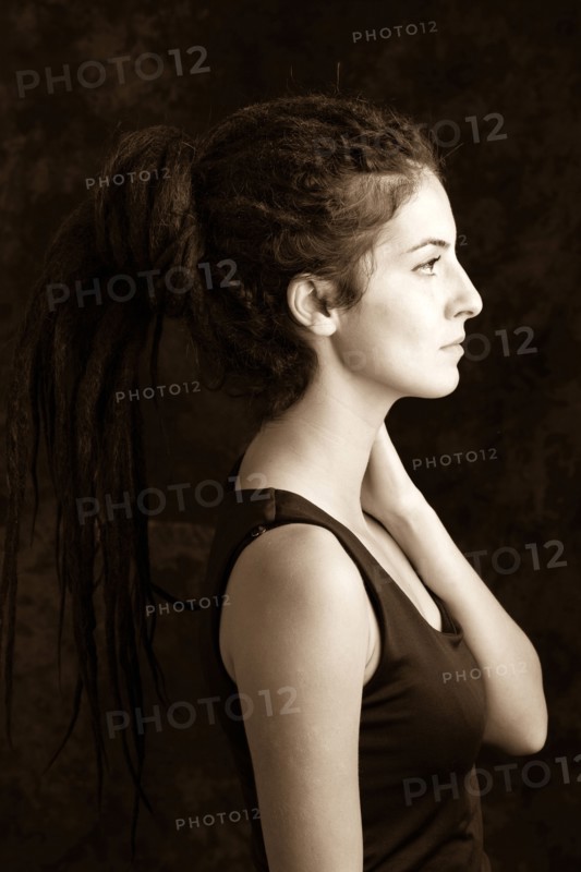 Close up profile of serious woman with dreadlocks