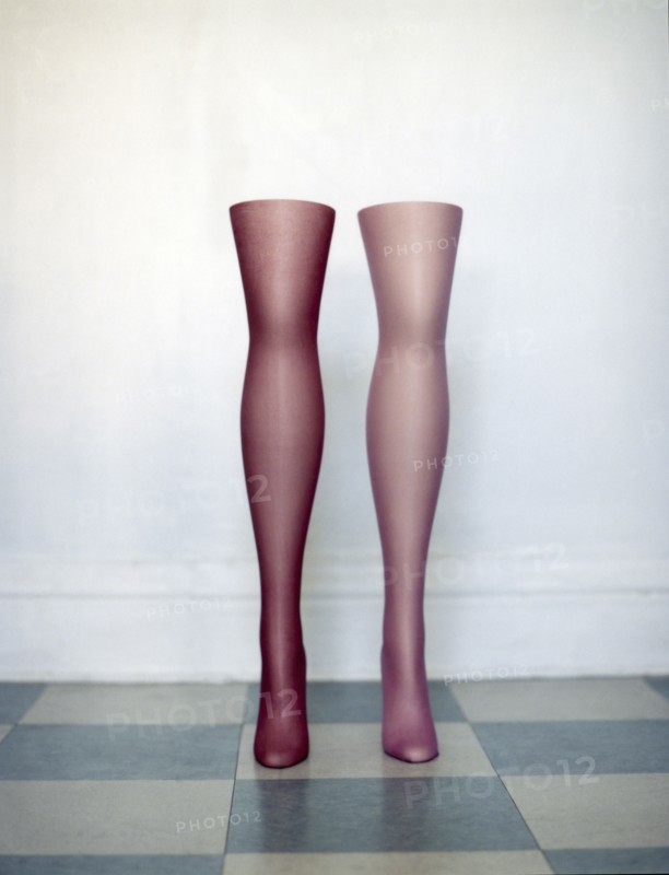 Mannequin legs standing on tiled floor