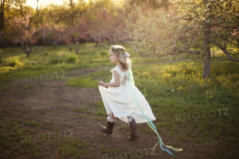 Caucasian girl walking on dirt path