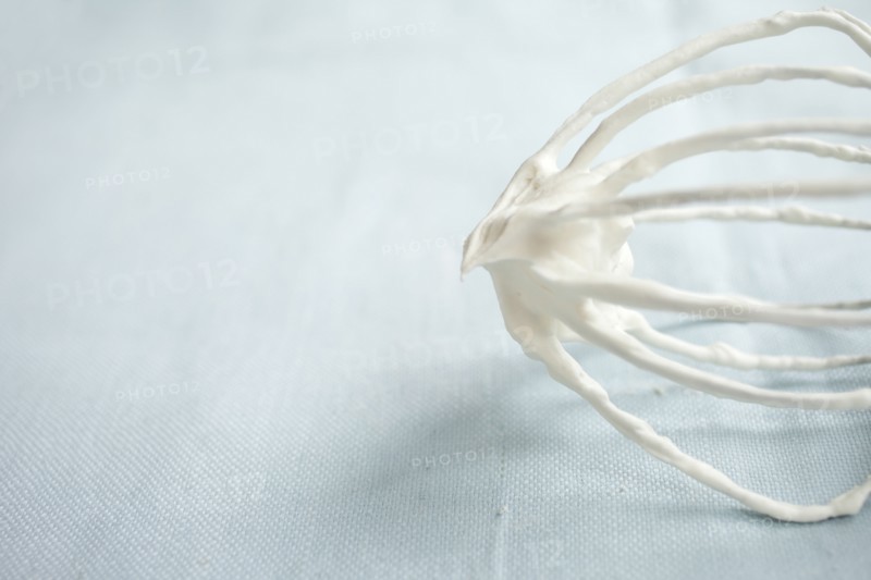 Close up of whipped cream on whisk