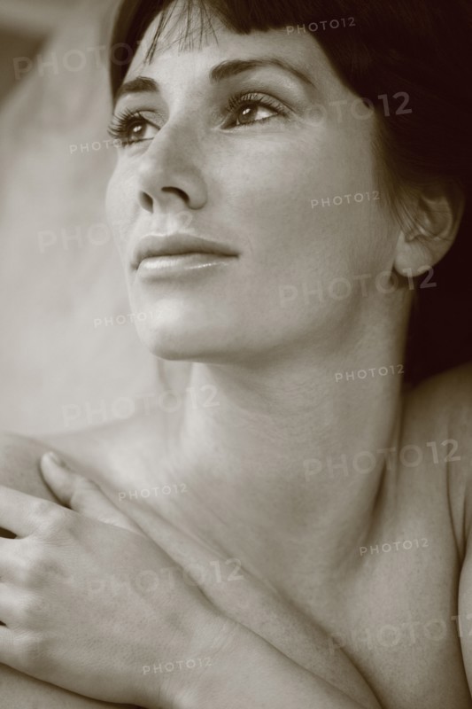 Nude Caucasian woman looking up