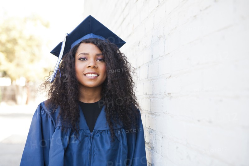Black graduate wearing cap and gown
