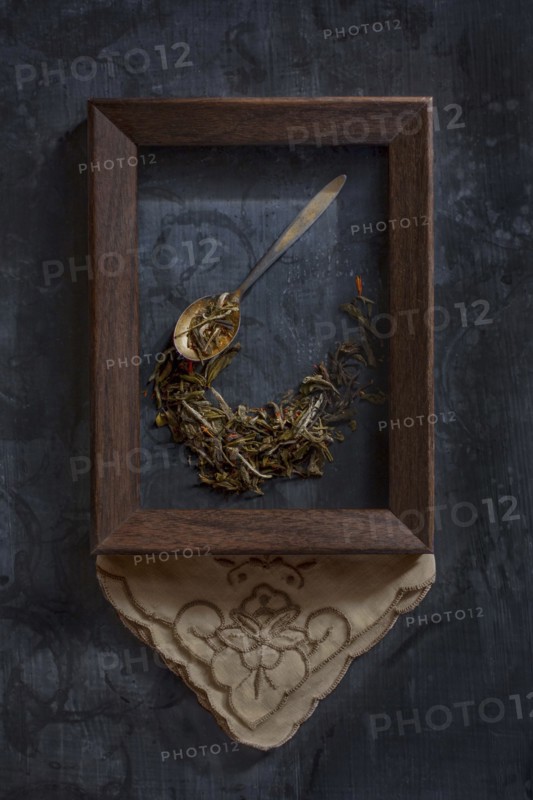 Herbs and spoon in picture frame