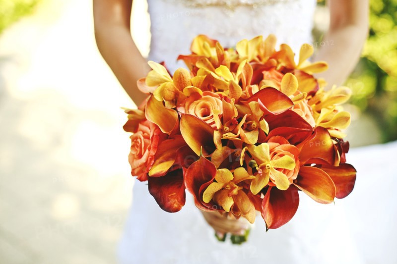 Bride carrying bouquet of flowers