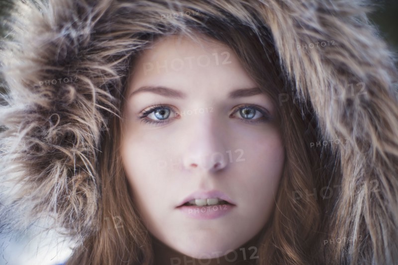 Close up of woman wearing fur hood