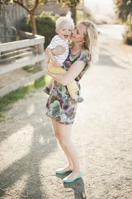 Mother holding son outdoors