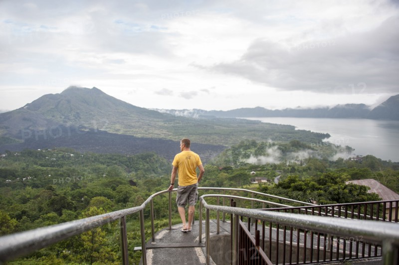 Caucasian tourist admiring scenic view of jungle