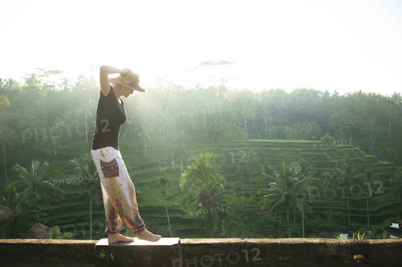 Caucasian tourist over rural rice terrace