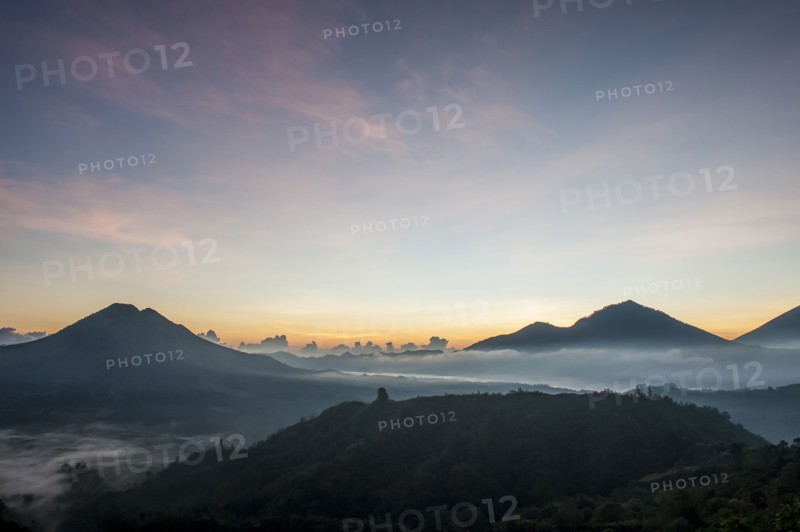 Hilltops over morning fog in remote landscape