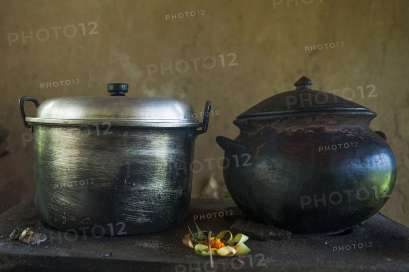 Close up of iron and steel pots on kitchen counter