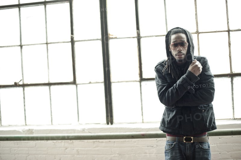 Black man standing at window