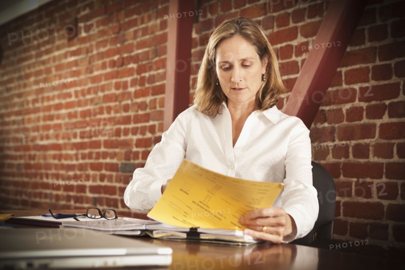 Caucasian businesswoman working in office
