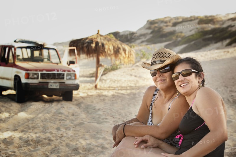 Hispanic women enjoying the beach