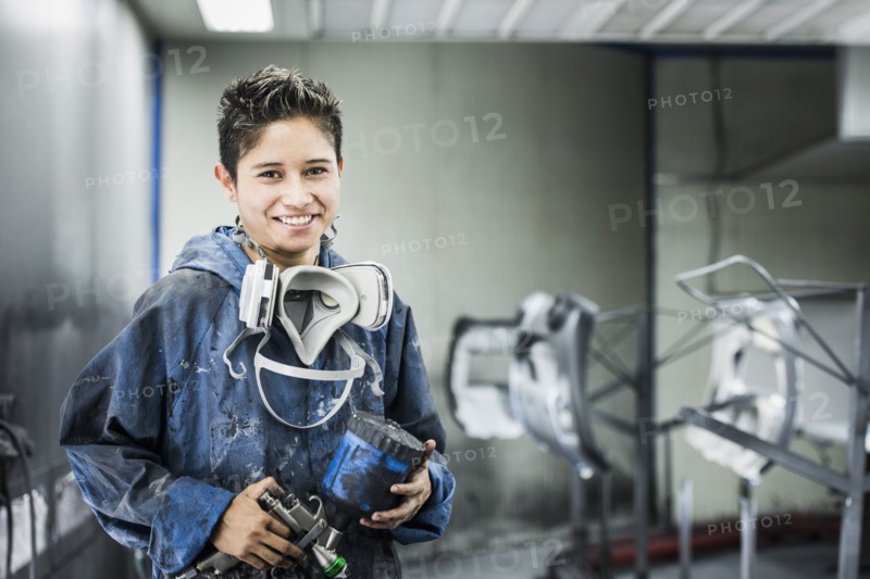 Worker smiling in manufacturing plant