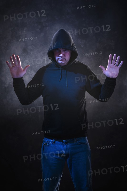 Caucasian man wearing black hoodie