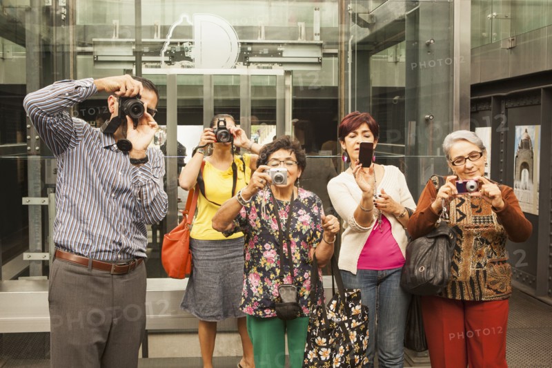 Tourists taking pictures in museum