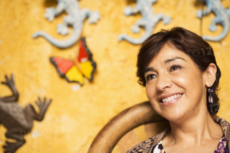 Hispanic woman smiling in chair