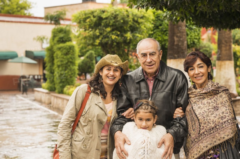 Family smiling together outdoors