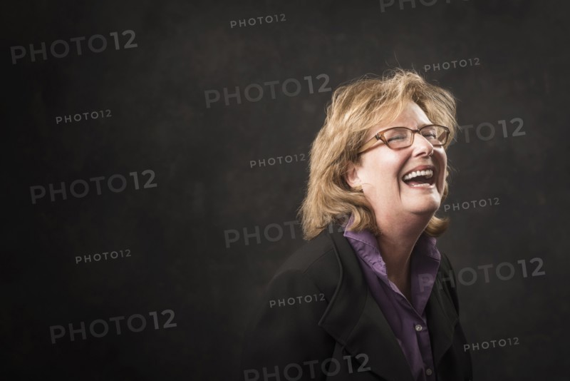Caucasian businesswoman laughing