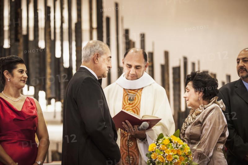 Senior couple exchanging vows at wedding