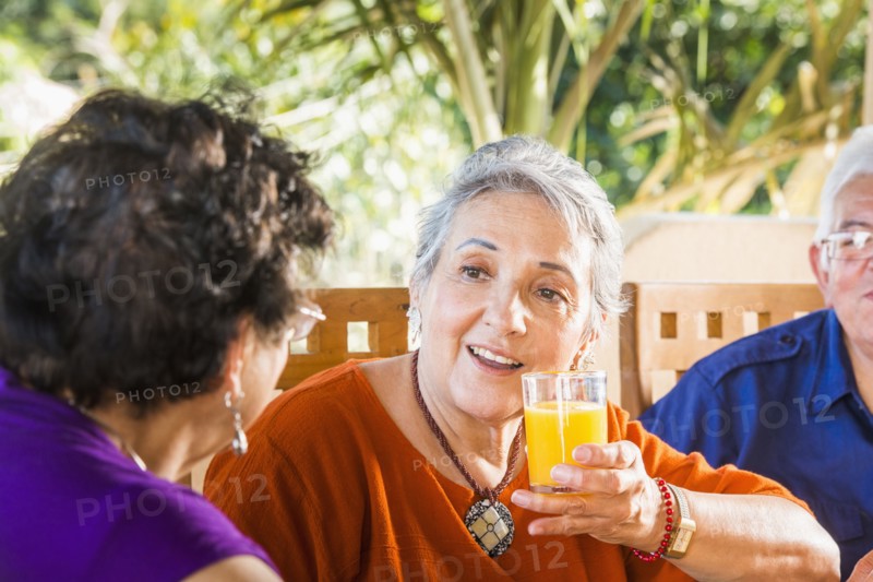 Hispanic women talking at table