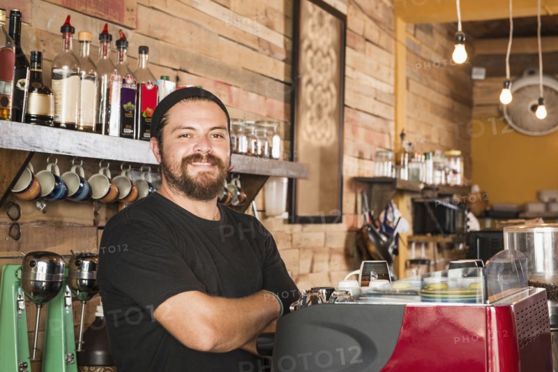 Hispanic man working in coffee shop