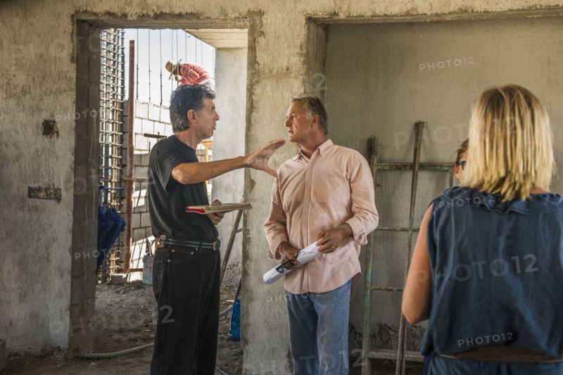 Architects talking at construction site