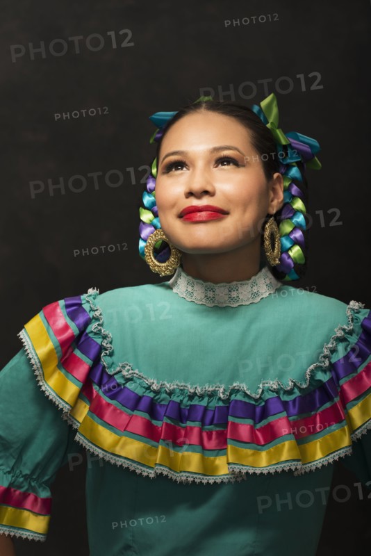 Hispanic teenage girl wearing Puebla Folkloric dress