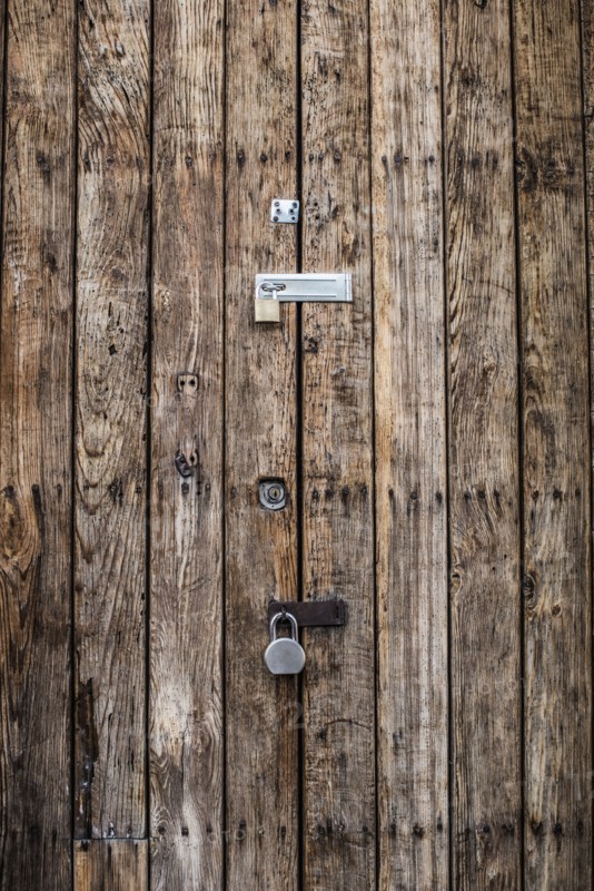 Close up of padlocks on secure door